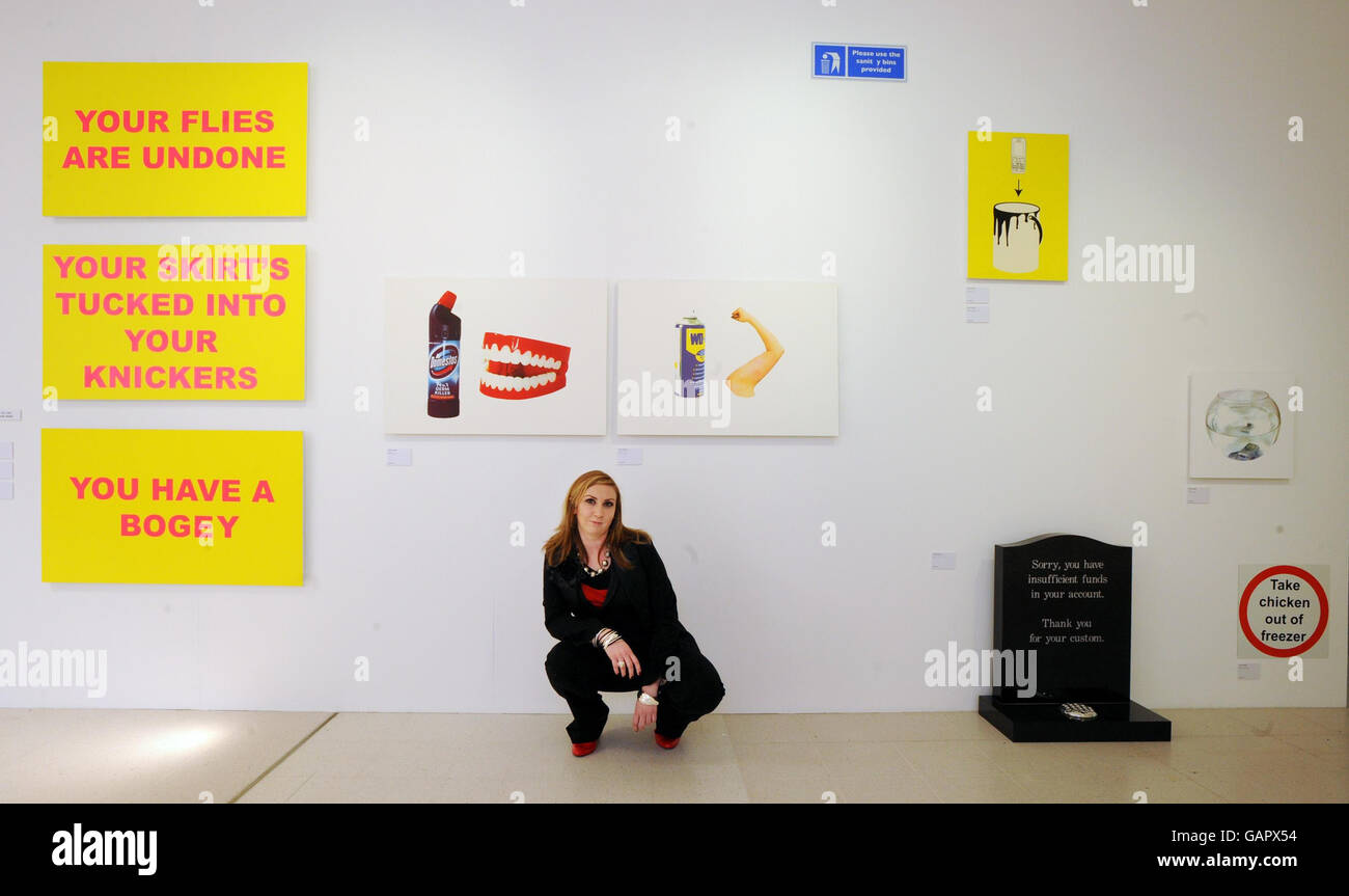 Fine artist and printmaker Clare Maunsell from Hastings with her work, which includes humorous signage, exhibiting from today at the Royal College of Art's annual graduate summer show in London. Stock Photo