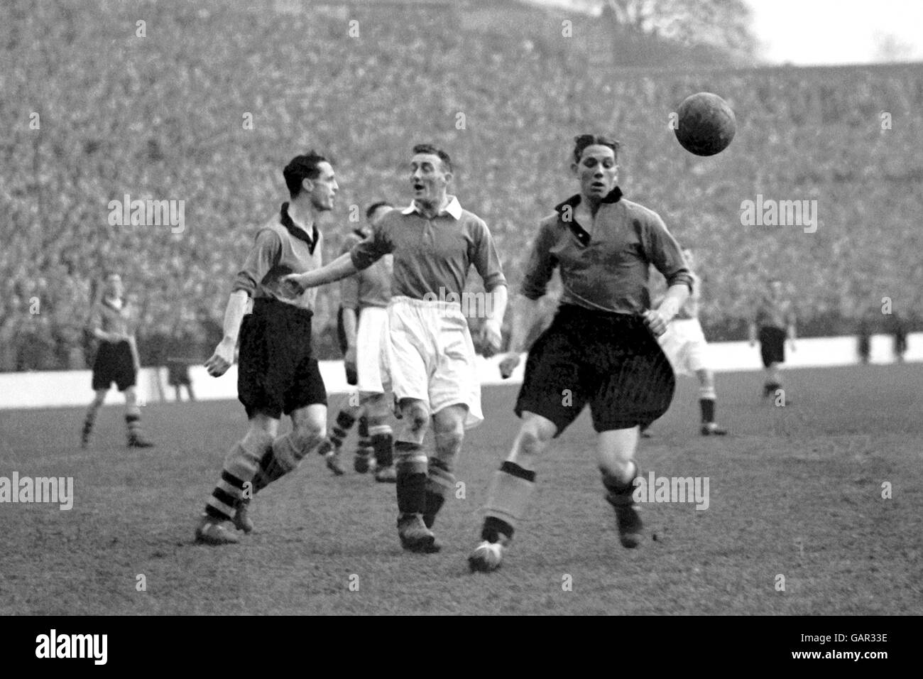 Wolverhampton Wanderers' Dicky Dorsett (r) and Bill Morris (l) pull up as Charlton Athletic's Sailor Brown (c) is flagged offside Stock Photo