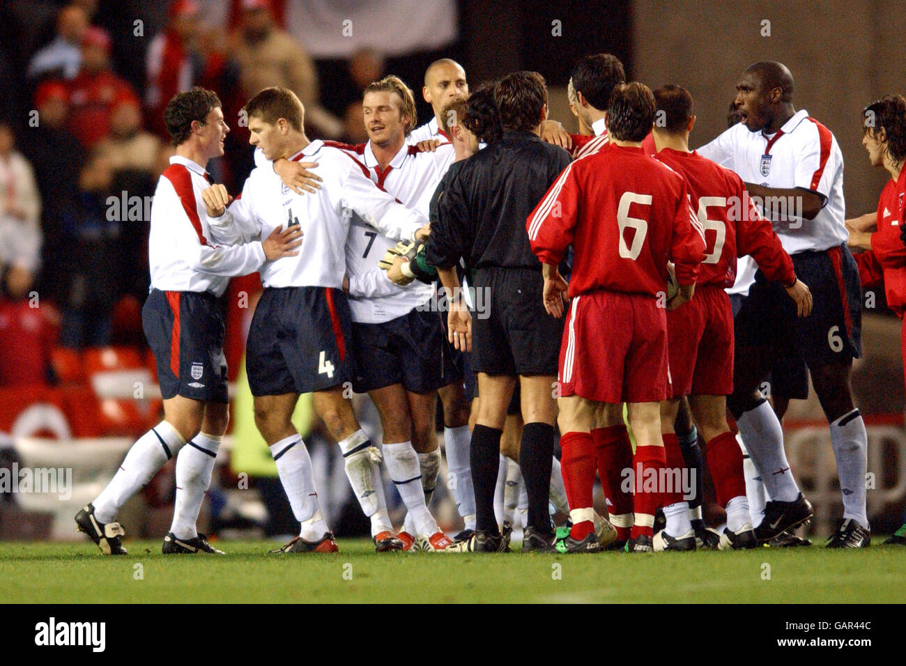 England captain David Beckham pulls Steven Gerrard away from Alpay of  Turkey at the end of the match Stock Photo - Alamy