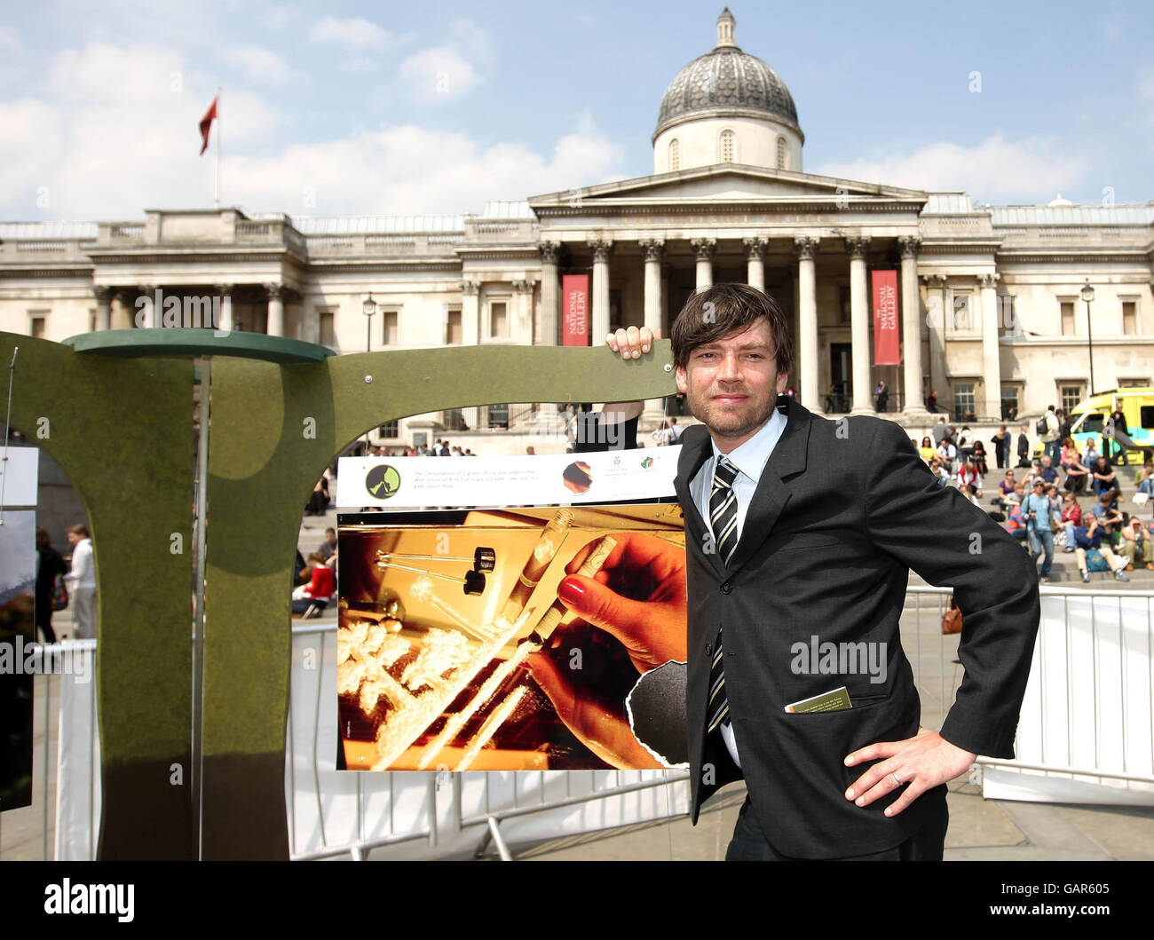 Blur bassist Alex James at an exhibition showing the environmental effects of cocaine production on Colombia, in Trafalgar Square, London. Stock Photo
