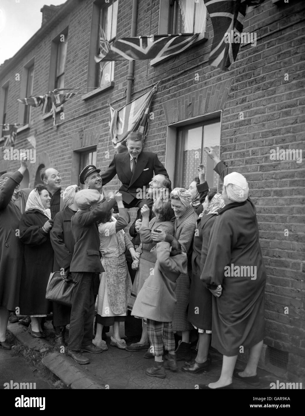 Olympic flyweight champion Terry Spinks is chaired by his