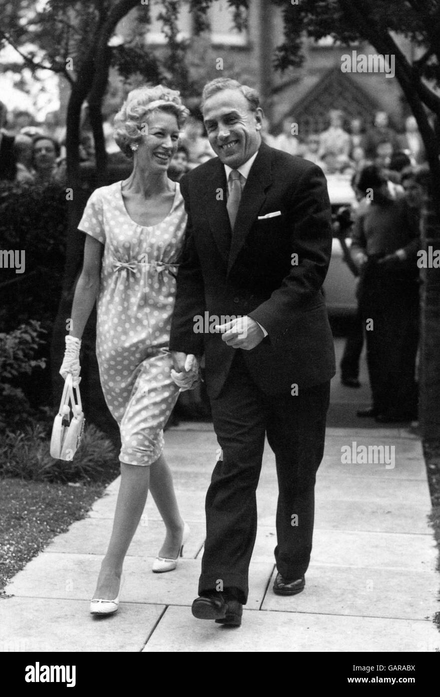 England and Wolverhampton football captain Billy Wright leaves the registrar's office with his bride, Joy, the eldest of the three singing Beverley Sisters, after their marriage. Stock Photo