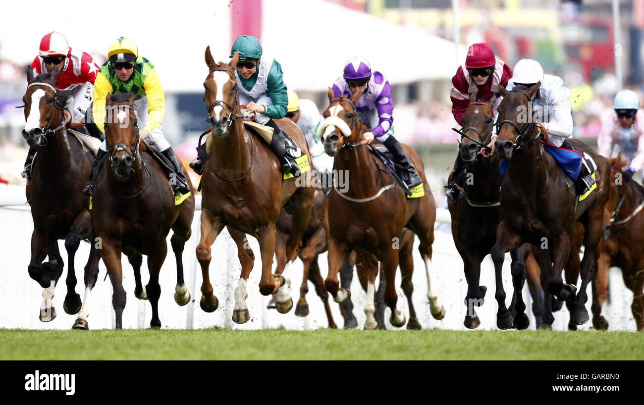 Holbeck Ghyll and Jockey William Buick (green hat) win the totesport.com Dash Heritage Handicap at Epsom Downs Racecourse, Surrey. Stock Photo