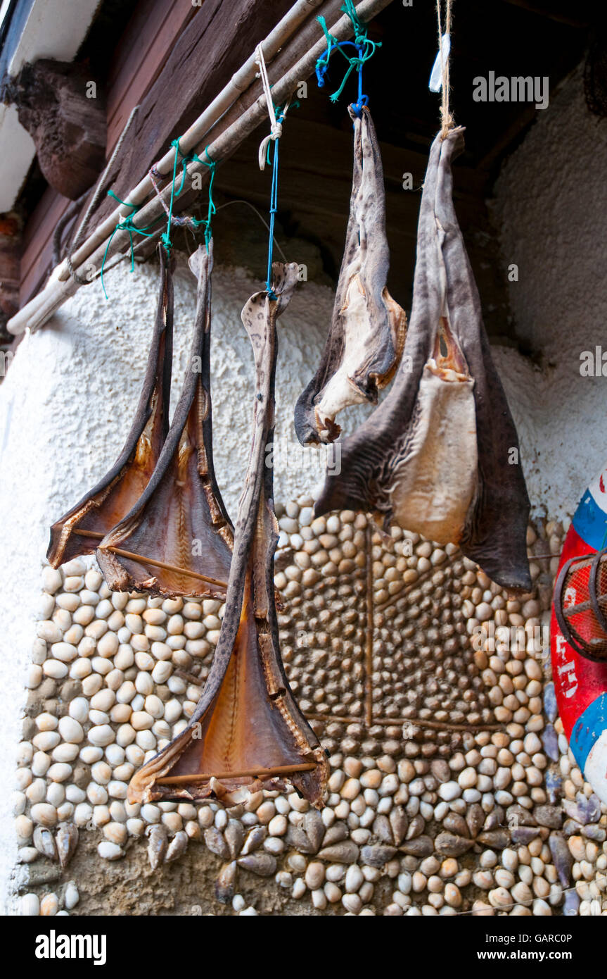 Curadillo, typical dried fish hanging on the harbour. Cudillero, Asturias, Spain. Stock Photo