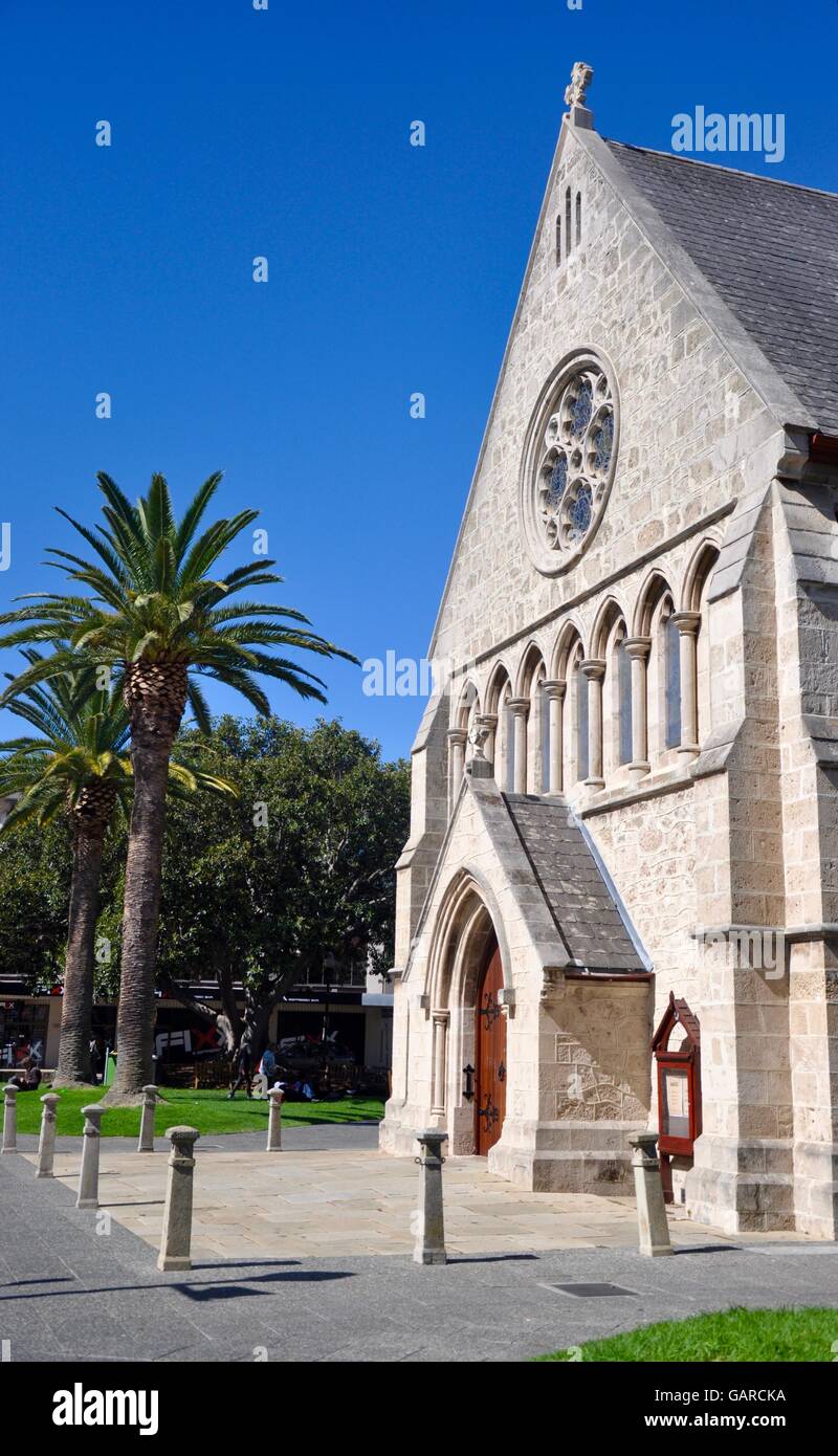 Historic old limestone brick architecture at St. John's Anglican Church with palm trees in