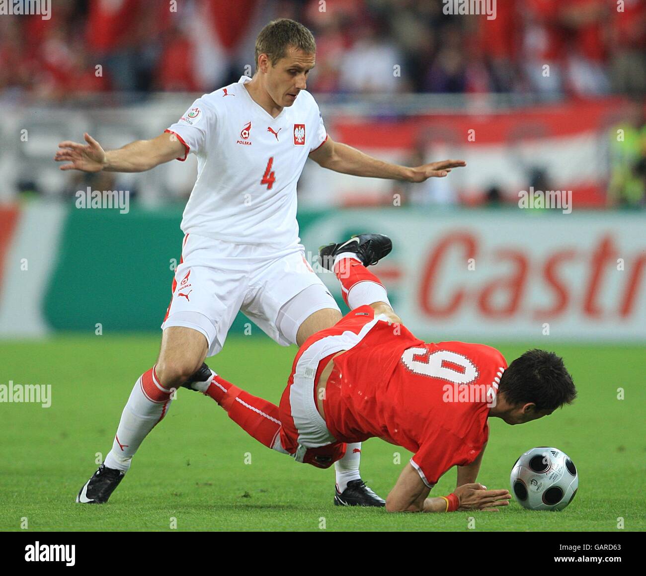 Austrias roland linz challenges polands pawel golanski for the ball hi