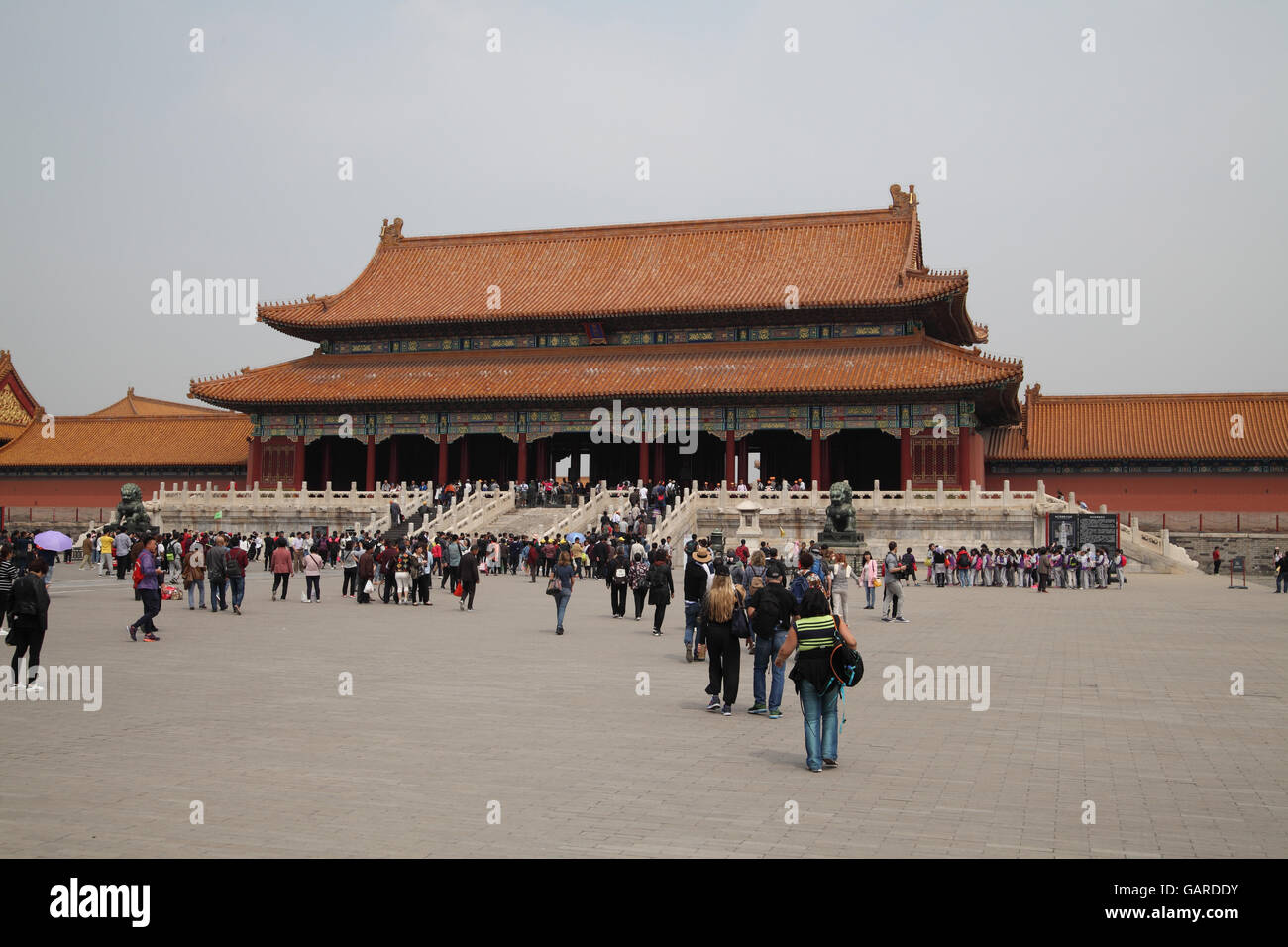Tourists, Chinese and foreigners walk to the Gate of Supreme Harmony in the Forbidden City. Beijing, China. 26.04.2016. Stock Photo