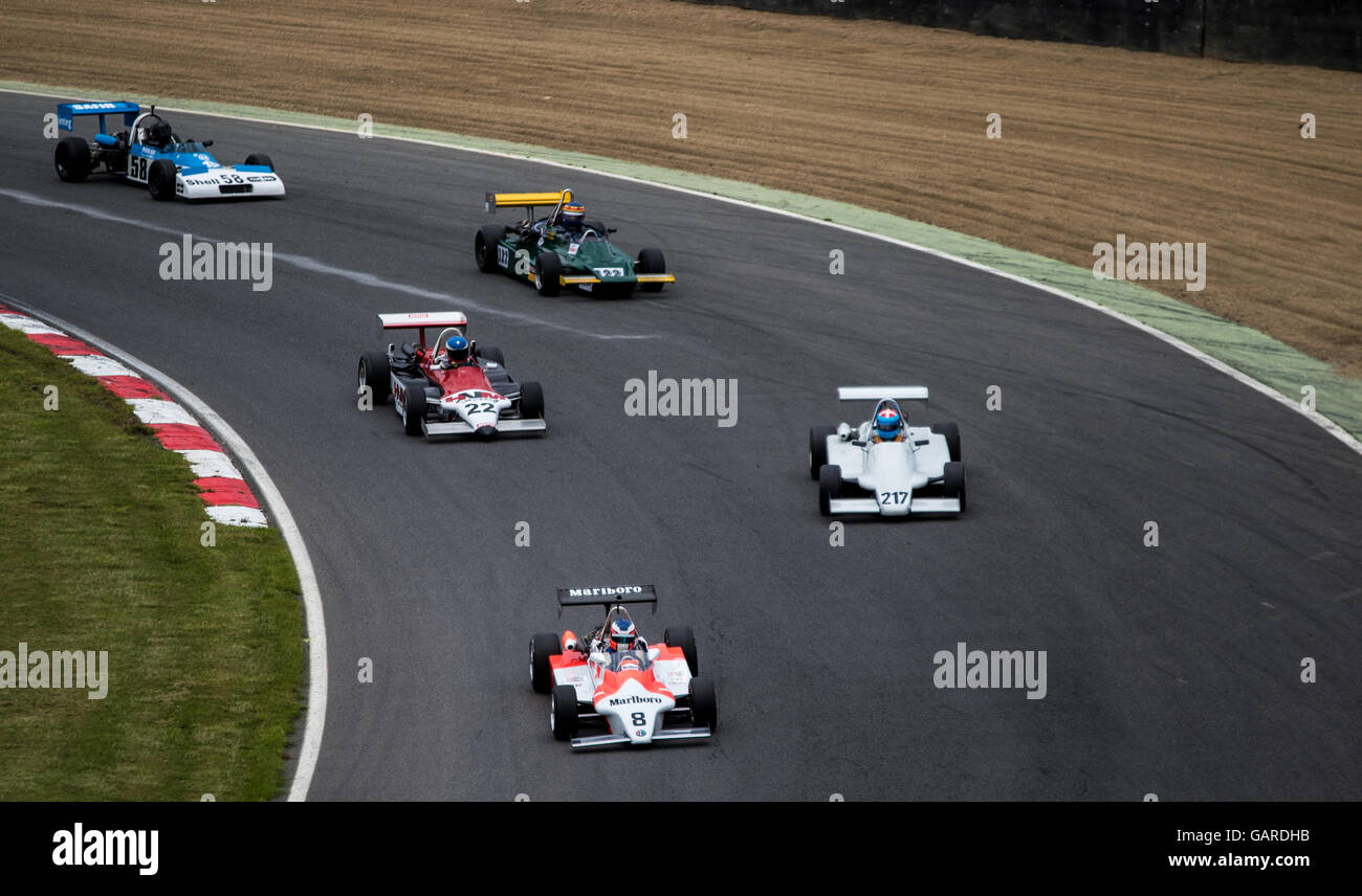 Cars racing on track in the Classic Formula 3 race at Brands Hatch, Legends of Brands Hatch Superprix Stock Photo