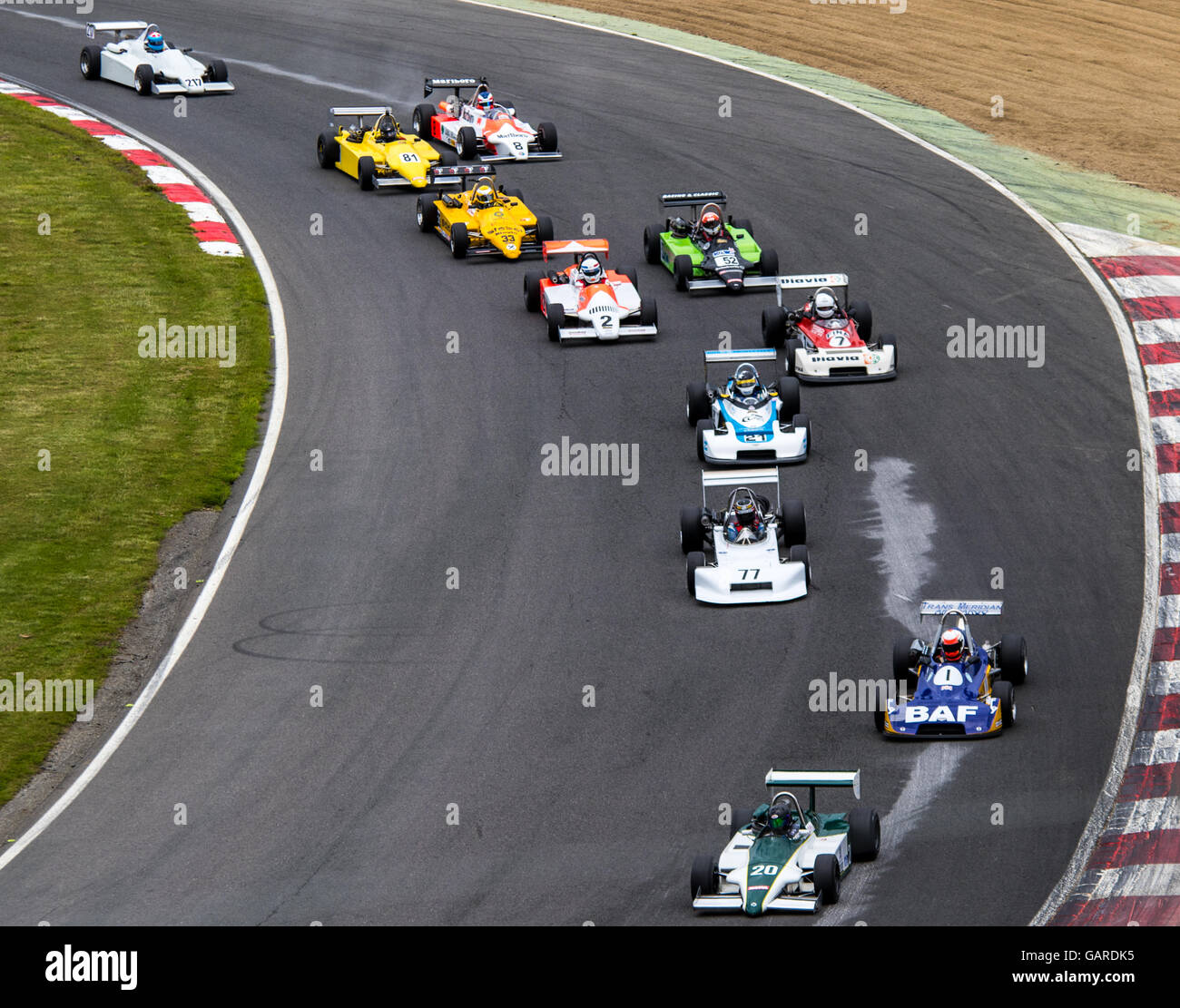 Cars racing on track in the Classic Formula 3 race at Brands Hatch, Legends of Brands Hatch Superprix Stock Photo