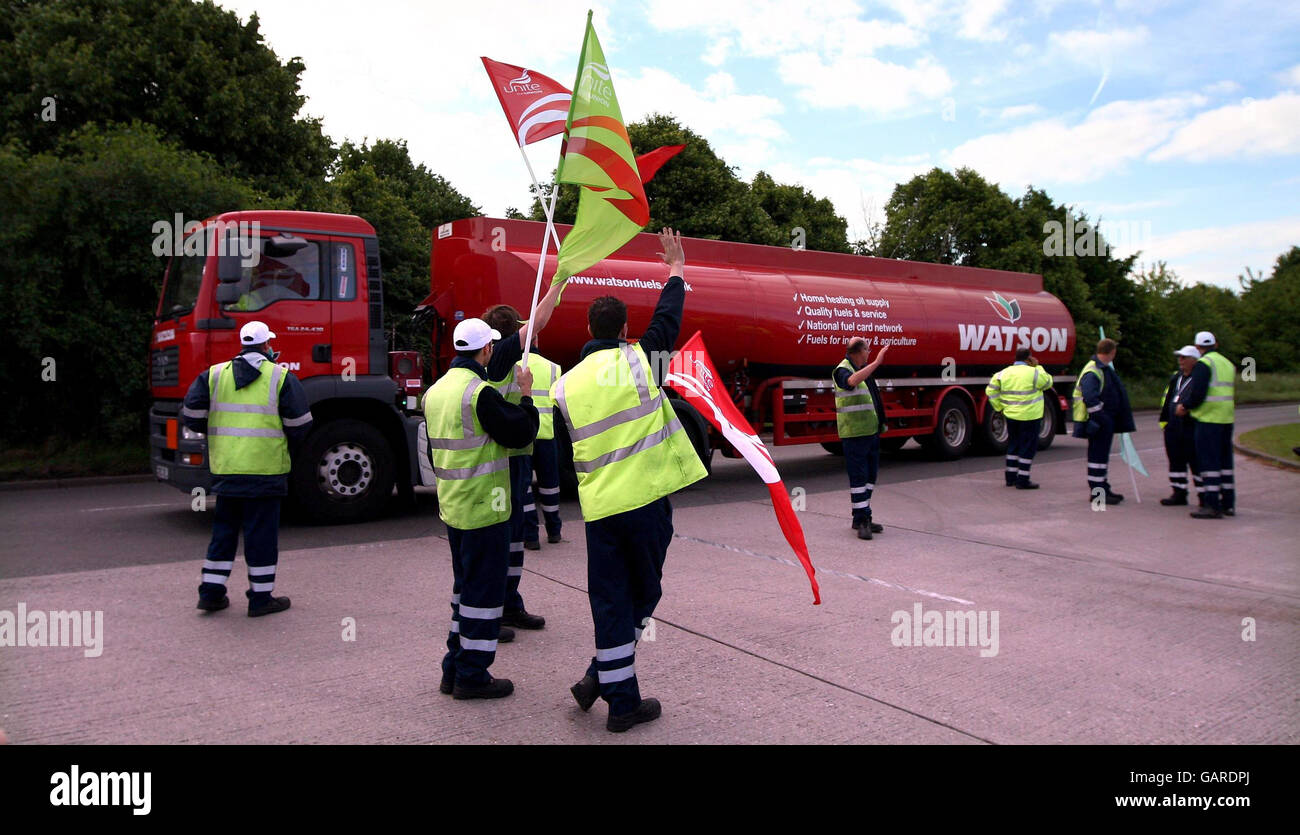 Picketers talk to tanker drivers as they leave the Kingsbury fuel depot