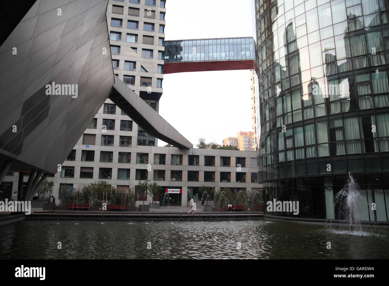 The Moma exclusive residential project designed by famed architect Steven Holl with a lake and covered bridges connecting the houses. Beijing, China. Stock Photo