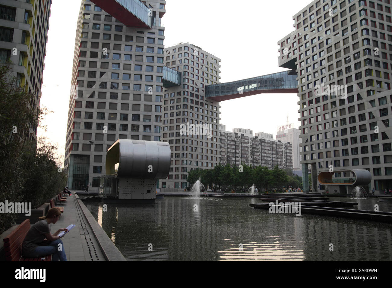 The Moma exclusive residential project designed by famed architect Steven Holl with a lake and covered bridges connecting the houses. Beijing, China. Stock Photo