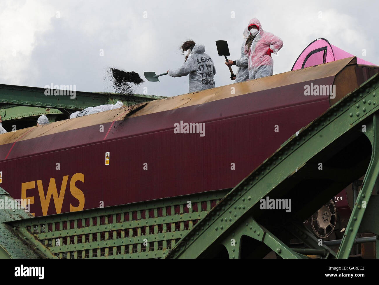 Protesters on a train carrying coal to the Drax power station in North Yorkshire after they stopped it just south of Drax. Stock Photo