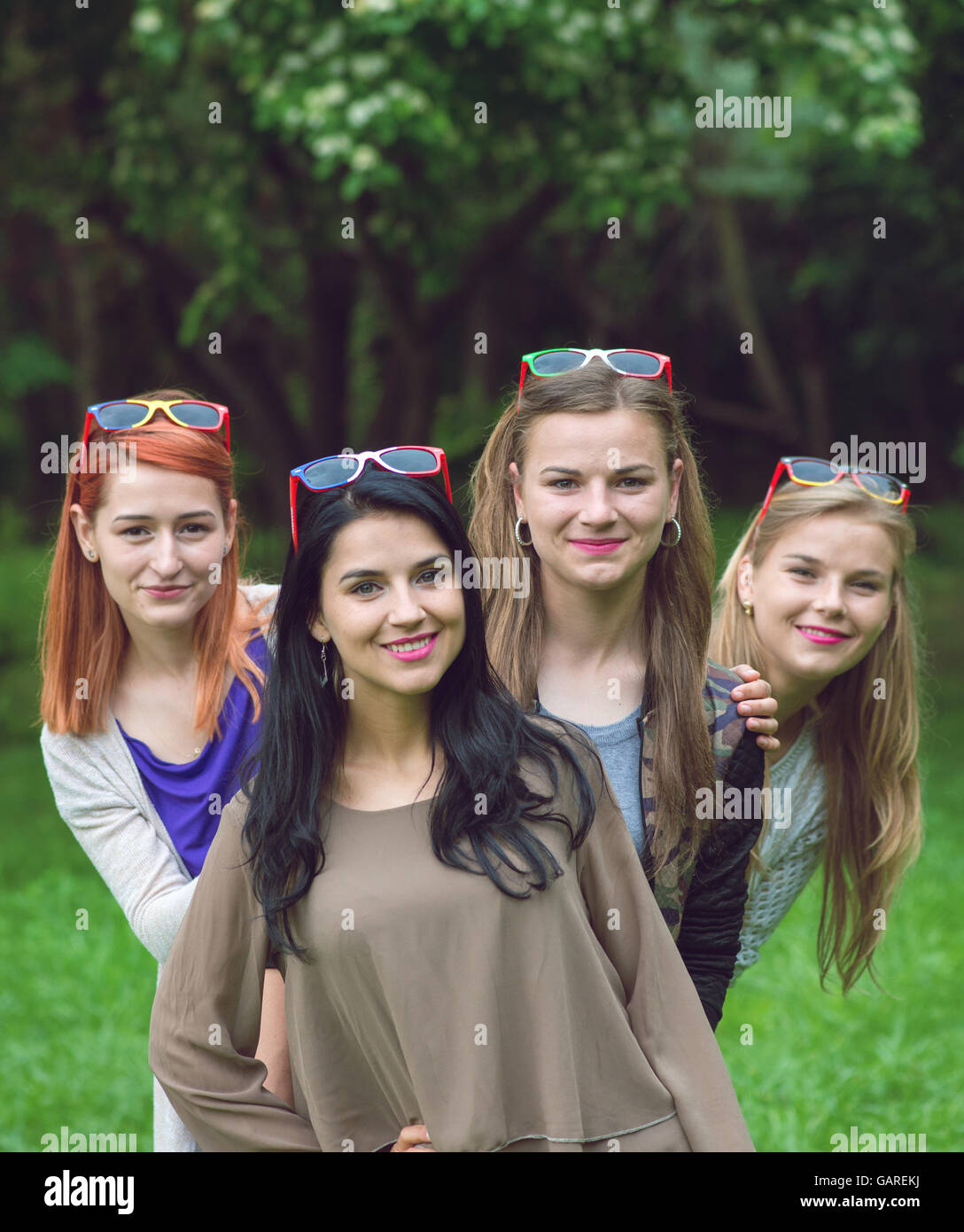 Happy friends posing together on a summer day Stock Photo - Alamy