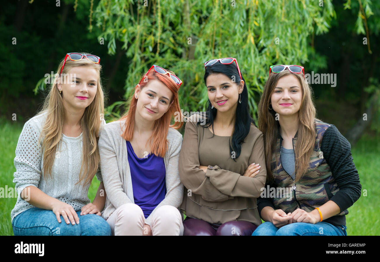 Happy friends posing together on a summer day Stock Photo - Alamy