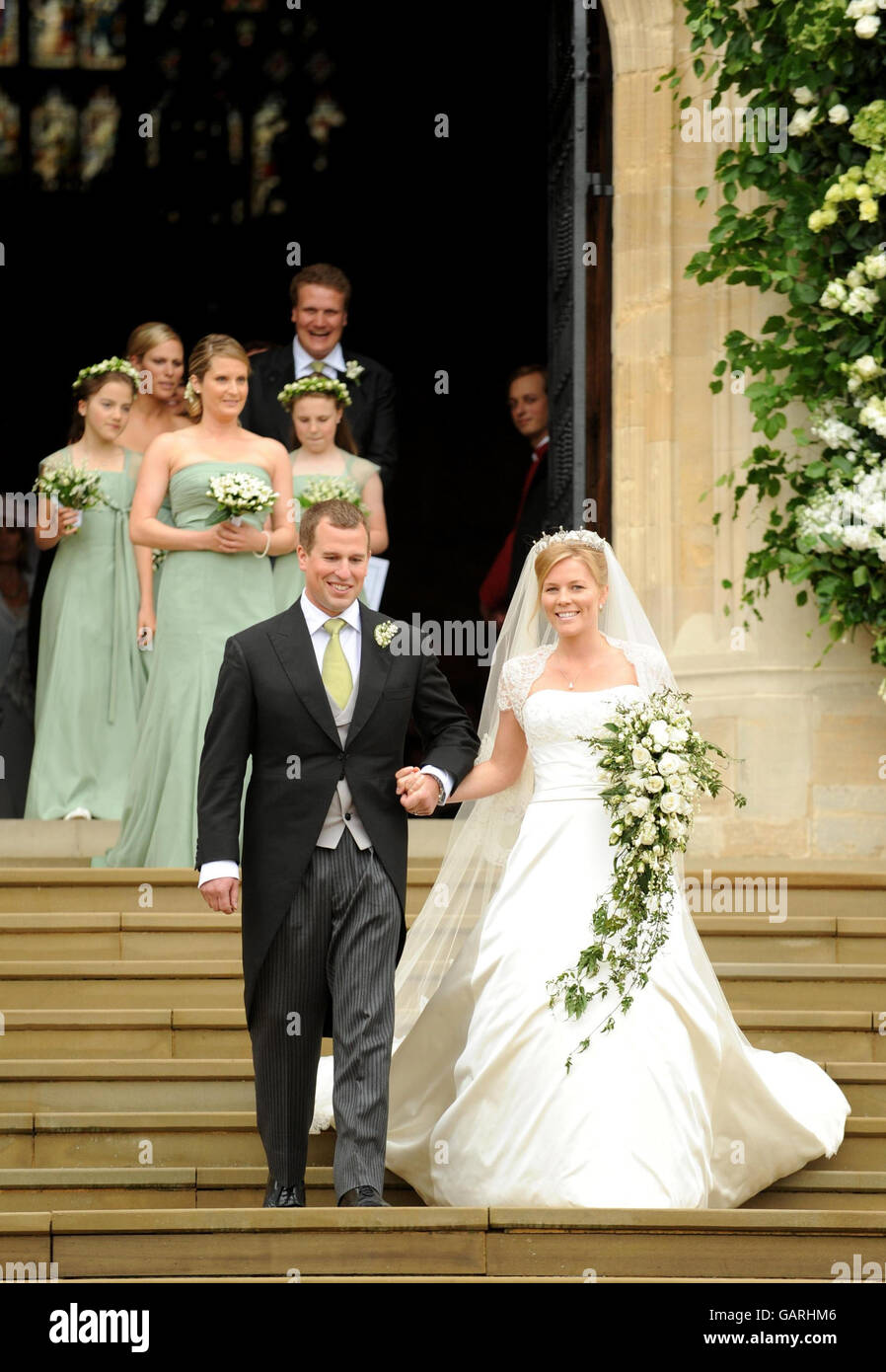 Peter Phillips, the eldest grandson of Queen Elizabeth II and Canadian Autumn Kelly leave St. George's Chapel in Windsor, England, after their marriage ceremony. Stock Photo