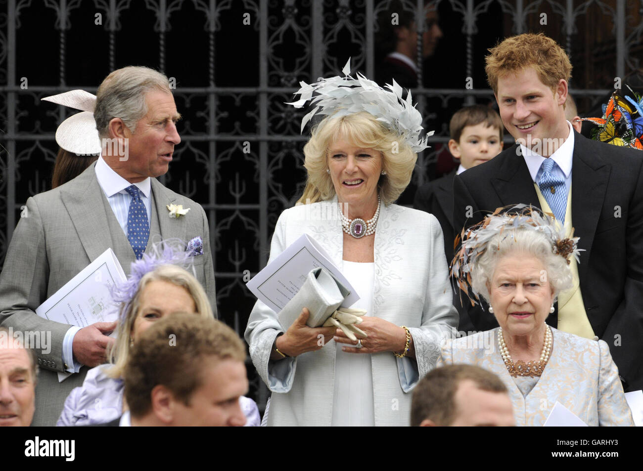 Queen Elizabeth II and the Prince of Wales, Duchess of Cornwall and Prince Harry outside St. George's Chapel in Windsor, England, after the marriage ceremony of Peter Phillips and Autumn Kelly. Stock Photo