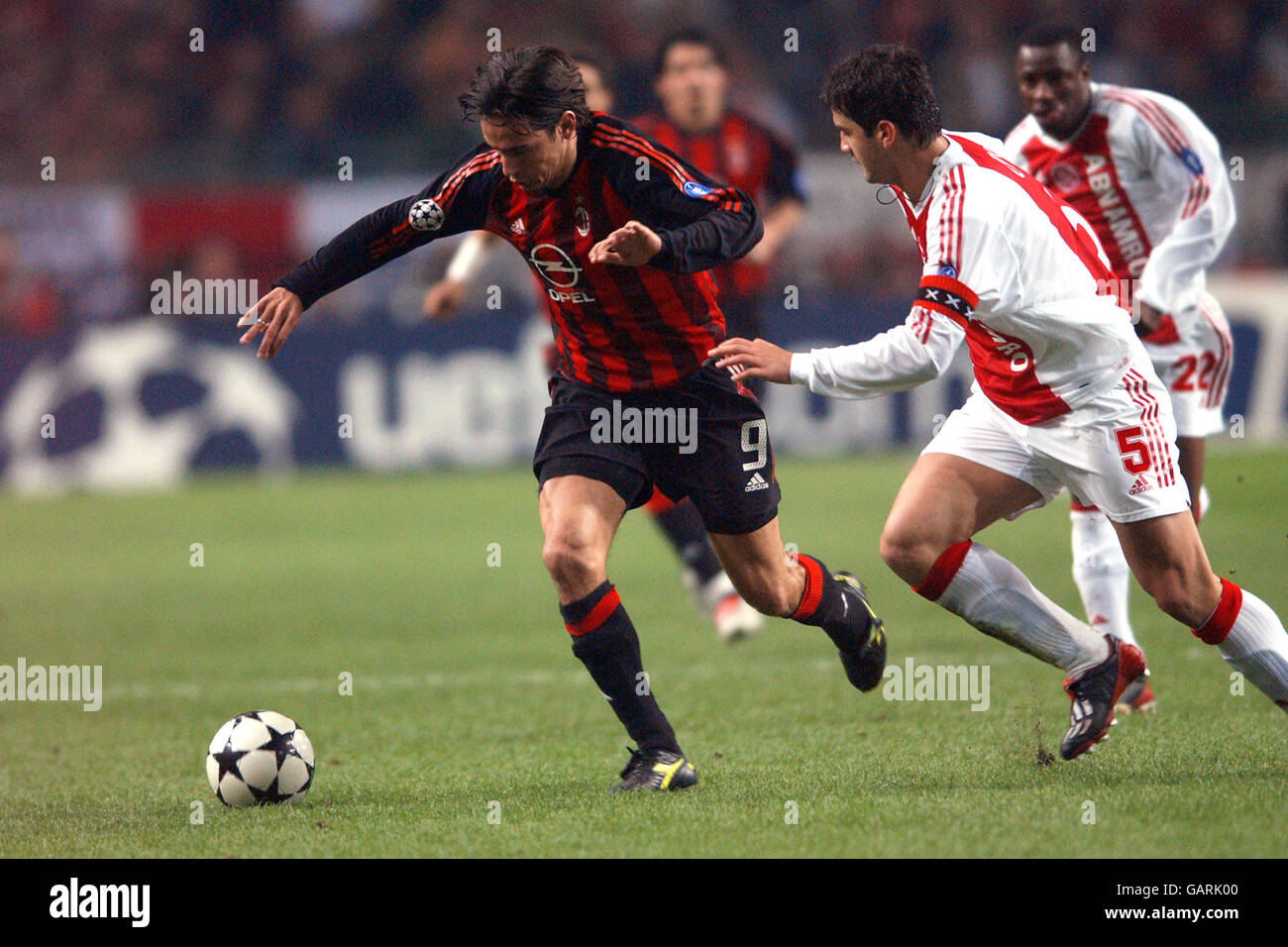 (L-R) AC Milan's Filippo Inzaghi and Ajax's Cristian Chivu battle for the ball Stock Photo