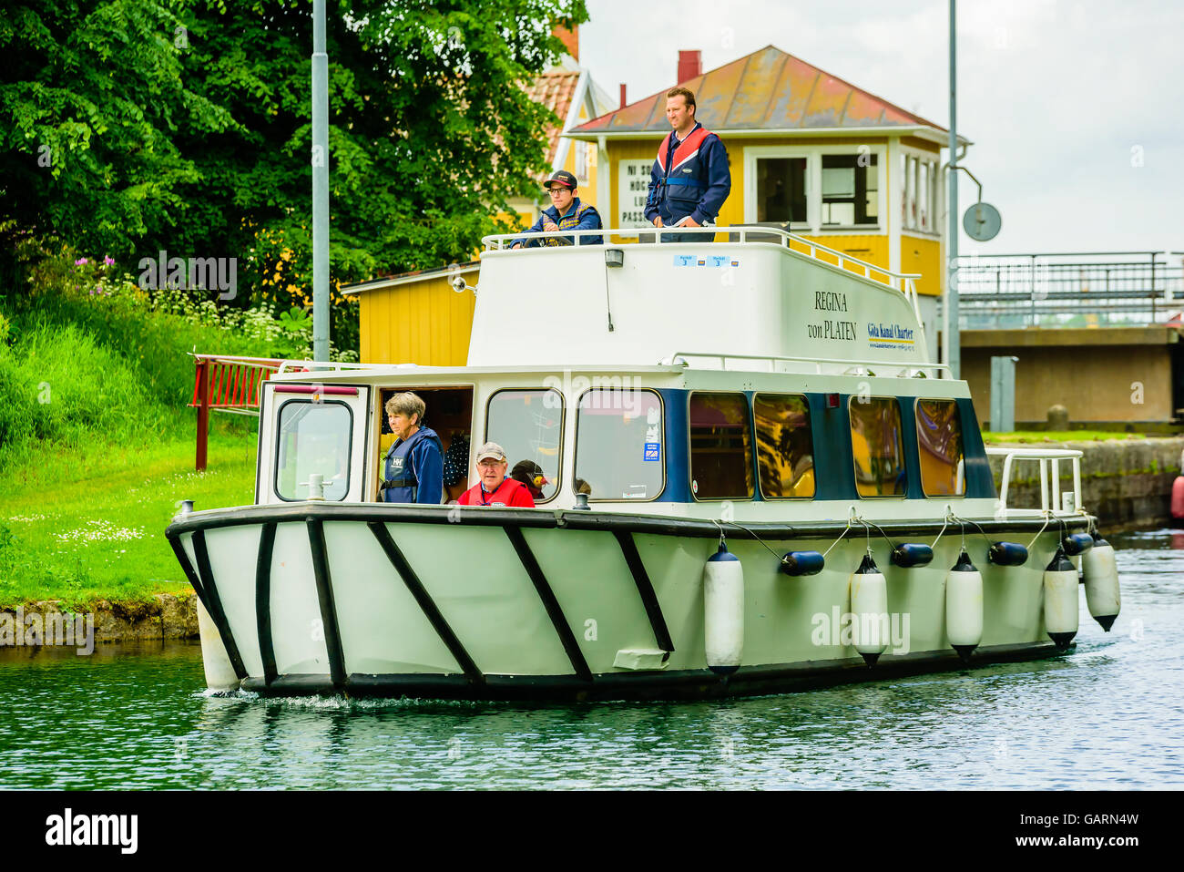 Motala, Sweden - June 21, 2016: People traveling with a chartered boat on the Gota canal. Real people in everyday life. Stock Photo
