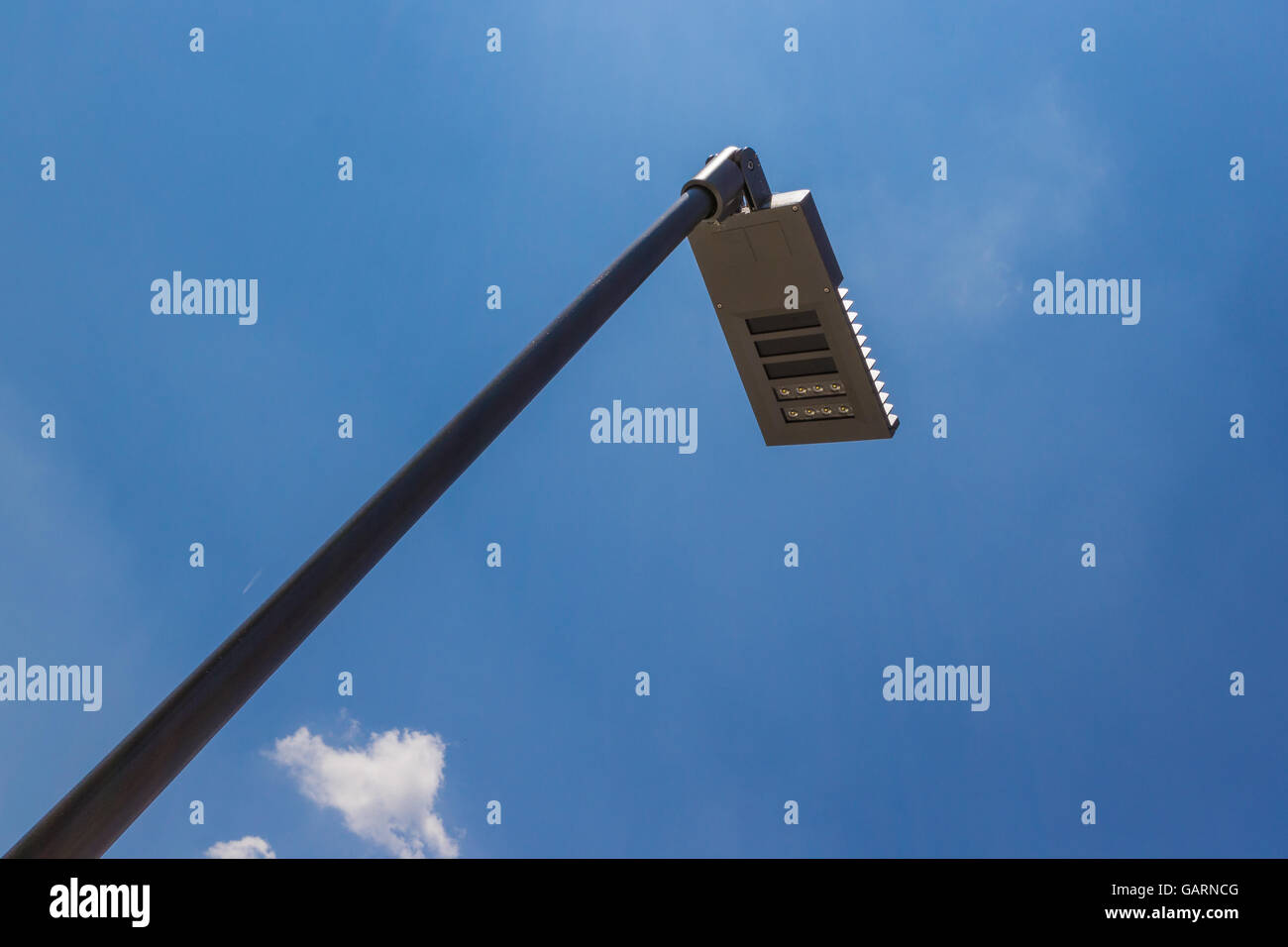 Modern street lighting against blue sky - bottom view Stock Photo