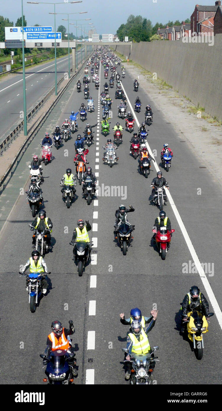 Bikers protest against rising fuel prices on the M62, Salford, in a slow-moving convoy causing rush-hour disruption to the area. Stock Photo