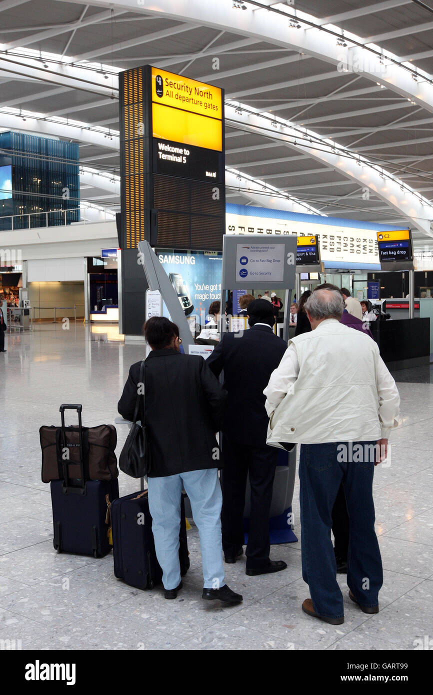 A passenger at Heathrow Airport as British Airways switch some of their long hall flights to Terminal 5. Stock Photo