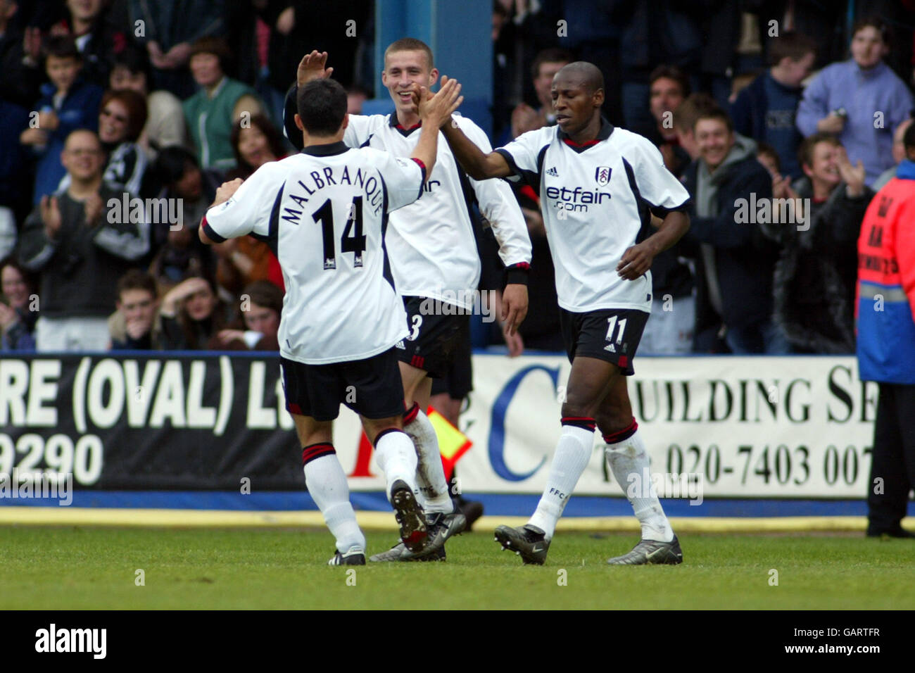 Soccer - FA Barclaycard Premiership - Fulham v Everton. l-r Fulham's Steed Malbranque, Sean Davis and Louis Boa Morte celebrate the opening goal an own goal from Everton's Alan Stubbs Stock Photo