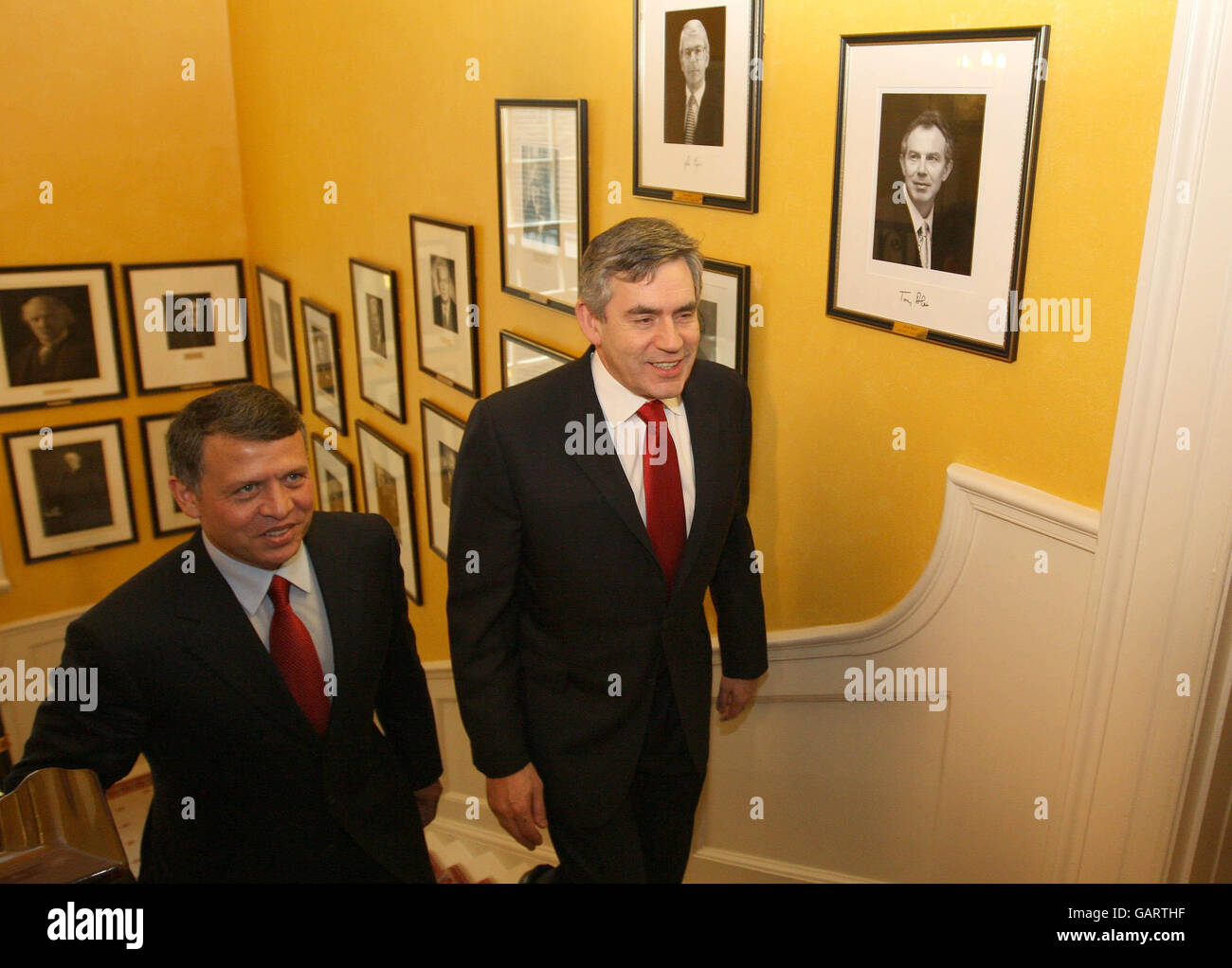 King Abdullah of Jordan (left) walks up the stairs of 10 Downing Street with Prime Minister Gordon Brown during a visit to London. Stock Photo