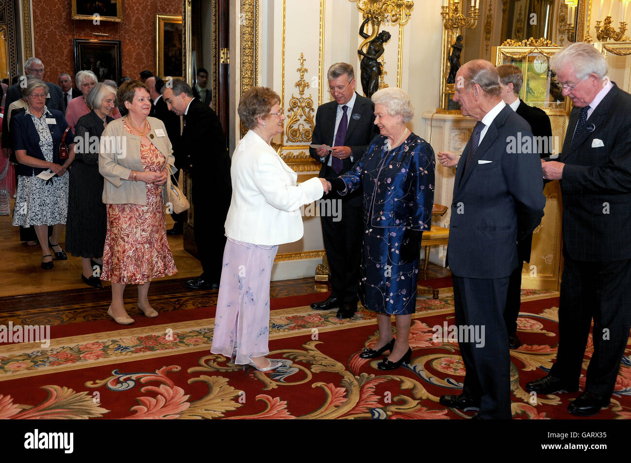 Reception Queen Queen hosts reception for voluntary workers hi-res stock photography ...