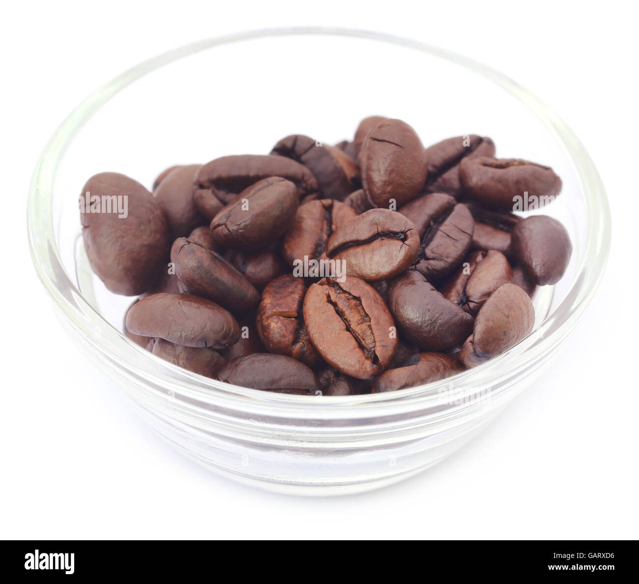 Roasted coffee bean in a glass bowl over white background Stock Photo ...