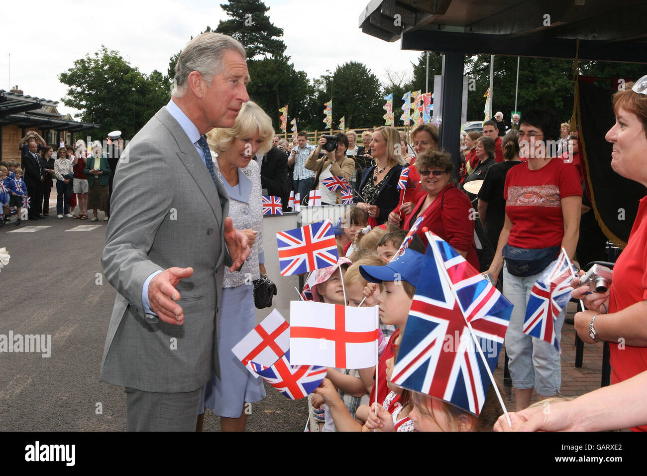 The Prince of Wales and the Duchess of Cornwall are greeted by local