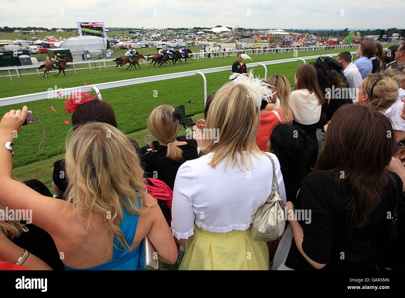 Women's Day Racers Racegoers watch the race from the stands during Ladies Day Stock Photo ...