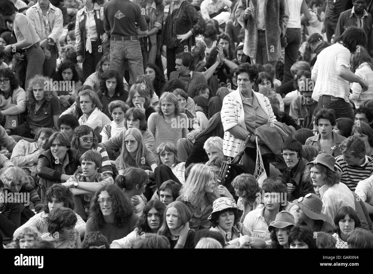 Rock fans gathering for a free concert, given by Queen, after returning to Britain from a world tour. The Hyde Park concert was a way of saying 'thank you' to their British fans. Stock Photo