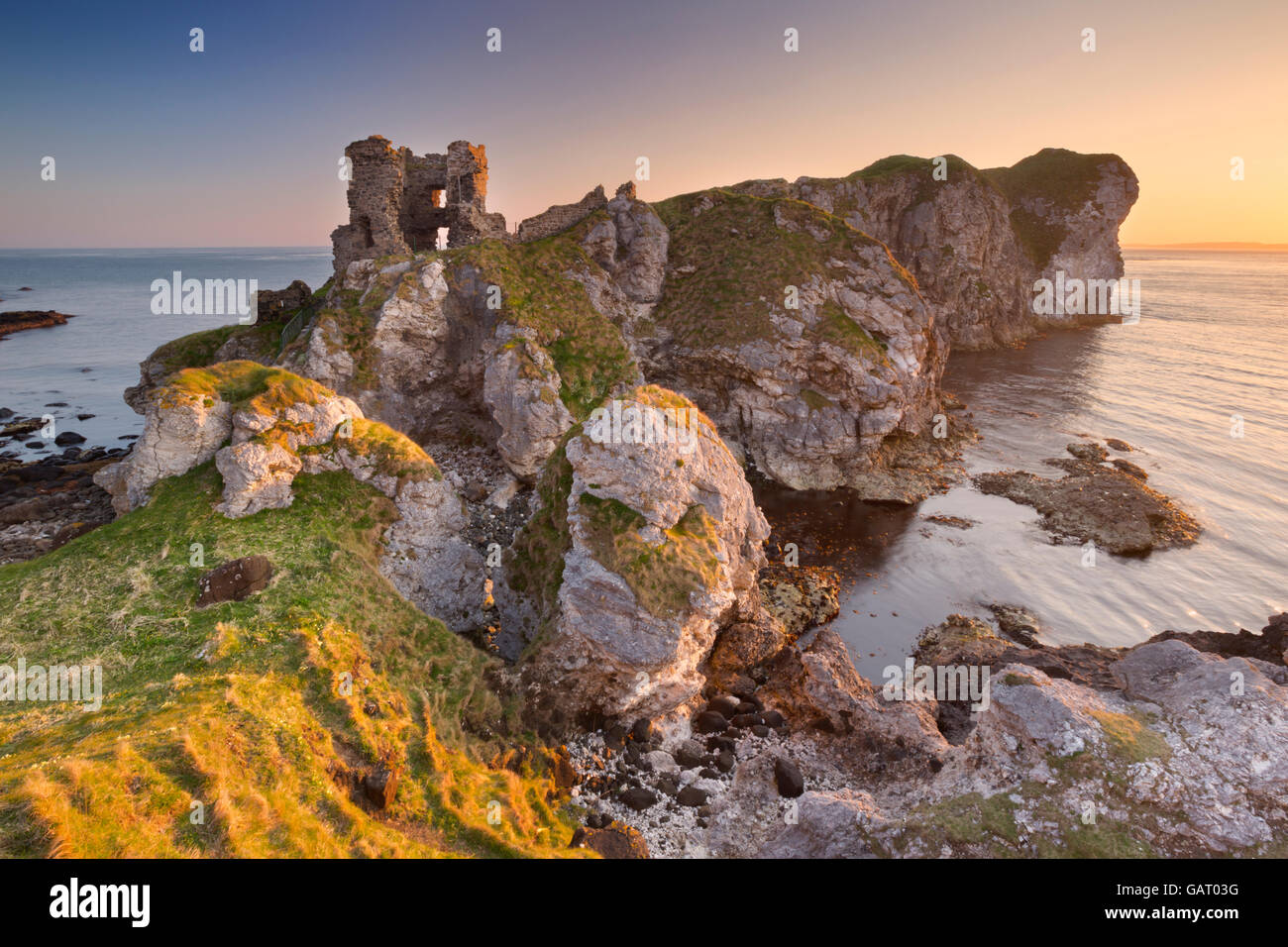 Sunrise at Kinbane Head with the ruins of Kinbane Castle on the Causeway Coast in Northern Ireland. Stock Photo