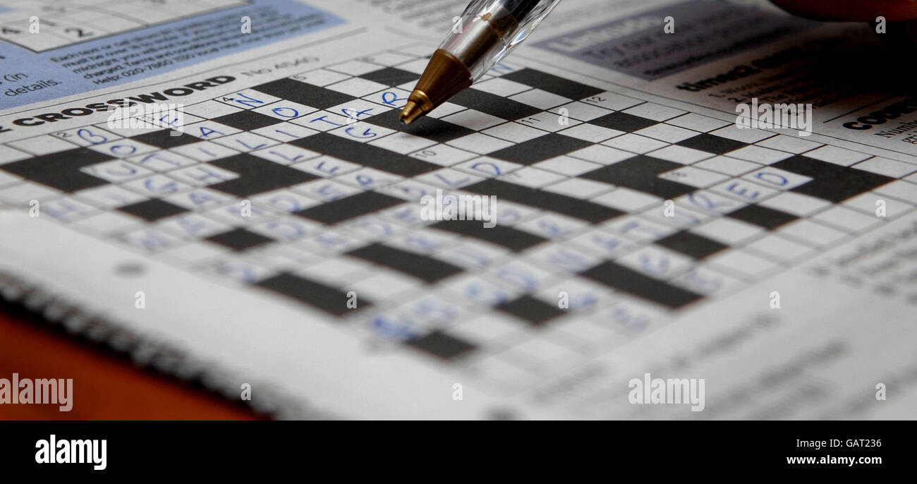 Generic photo of a crossword puzzle being completed with a ball point