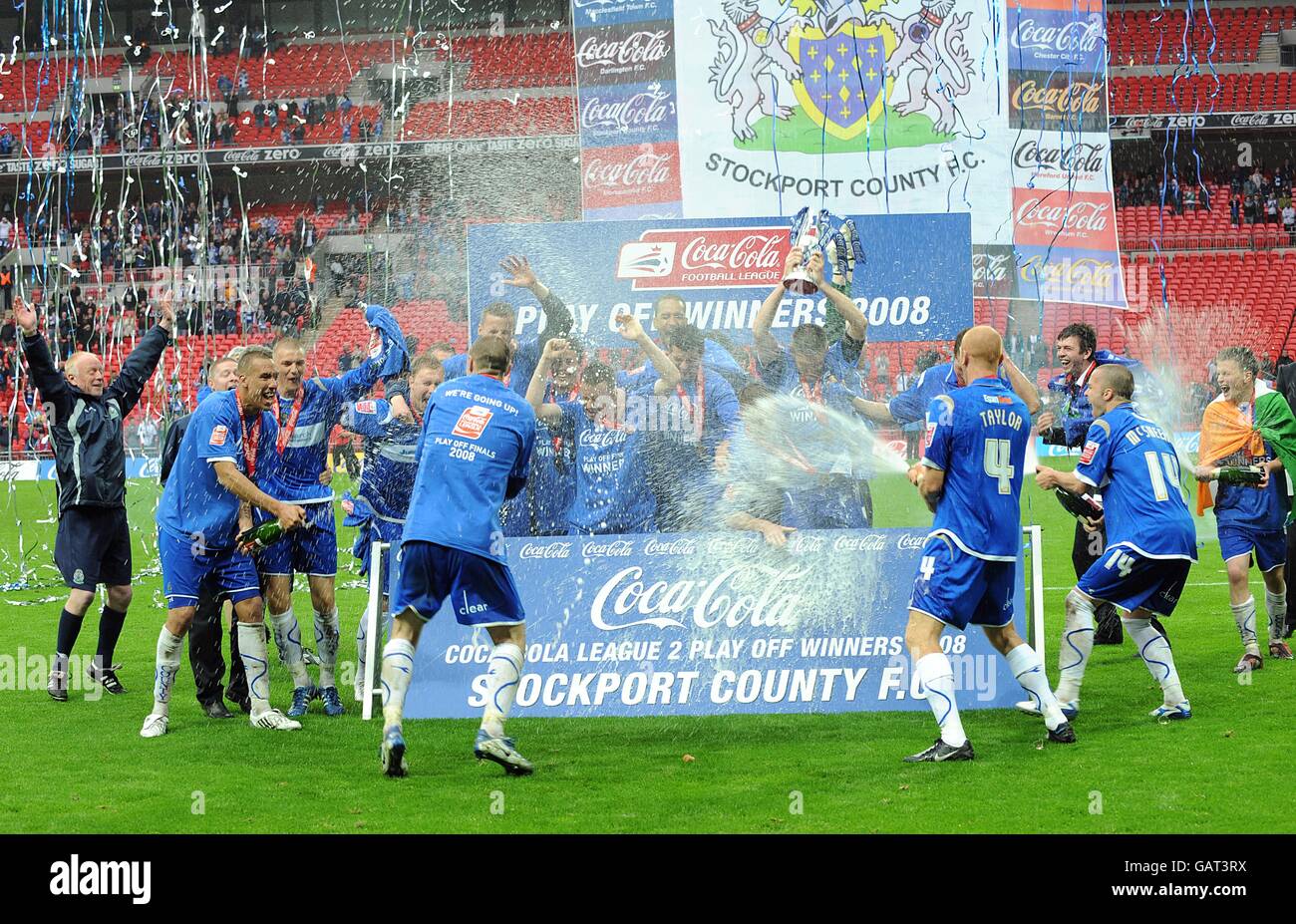 Stockport County players celebrate after winning the League Two Play
