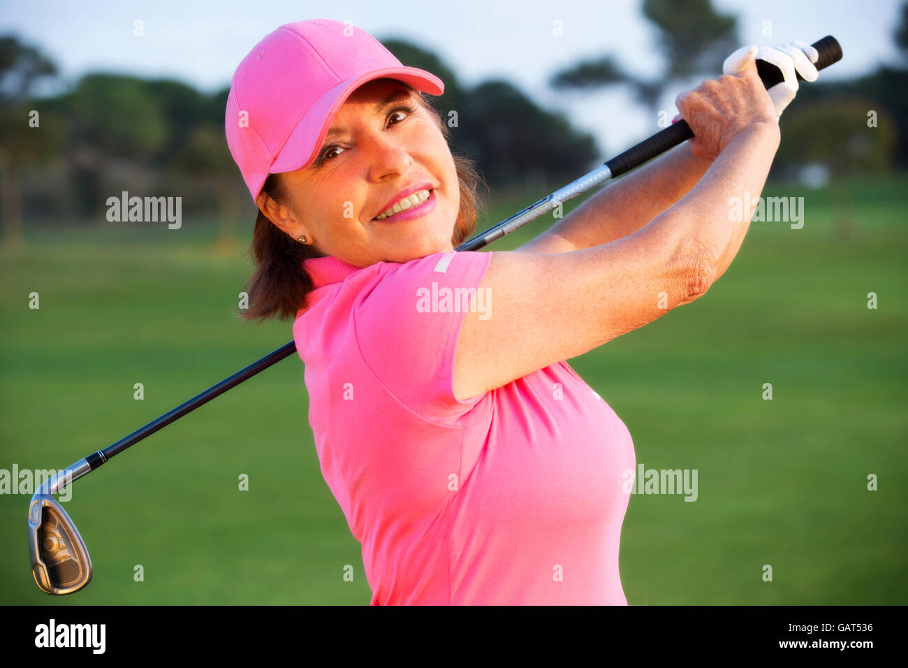 beautiful senior female golf player on a golf course Stock Photo Alamy