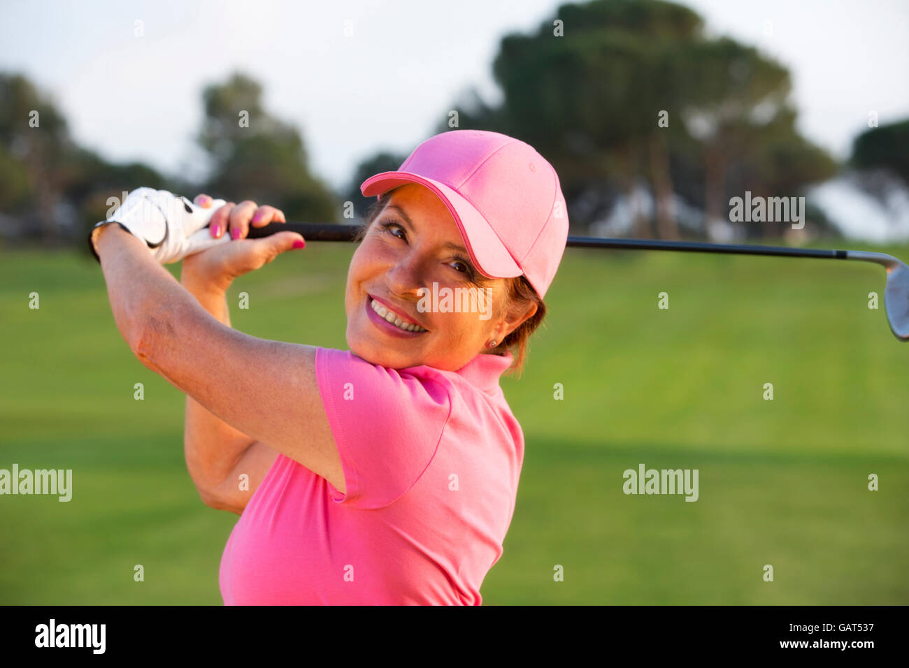 beautiful senior female golf player on a golf course Stock Photo Alamy