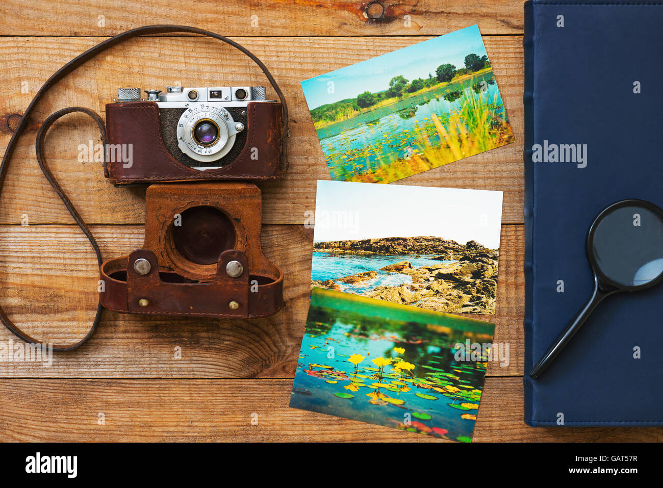 Vintage, very old film camera, magnifying glass, foto and photo album