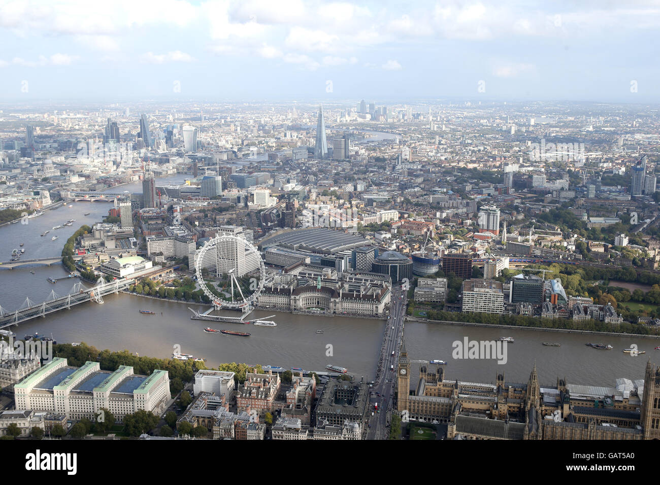 a view of london city skylinewith houses of parliment and london eye from a helicopter Stock Photo