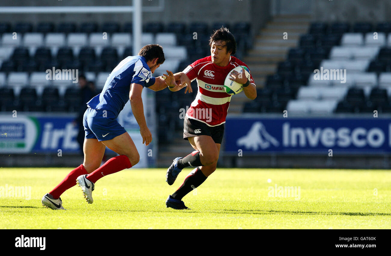 Japan's Kanzo Nakahama is tackled by France's Mathieu Belie during the Invesco Perpetual Junior Rugby World Cup match at Liberty Stadium, Swansea. Stock Photo