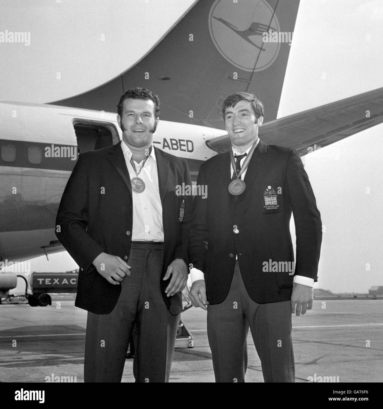 Keith Remfry, left, and David Starbrook, arriving back from the World Judo Championships where they both won gold medals. Starbrook went on to win the silver medal in the 80-93kg category in the 1972 Munich Olympics Games, and Remfry won the silver medal in the Open Class at the 1976 Olympics in Montreal. Stock Photo