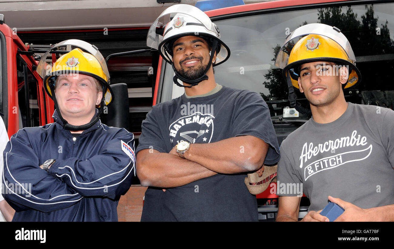 Ricky Hatton, David Haye and Amir Khan wear firefighters helmets during the opening of a boxer training facility at Moss Side Fire Station in Manchester. Stock Photo