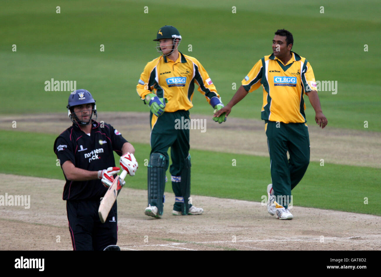 Nottinghamshire Outlaws' Samit Patel (r) celebrates with wicketkeeper Chris Read after taking the wicket of Durham Dynamos' Liam Plunkett Stock Photo