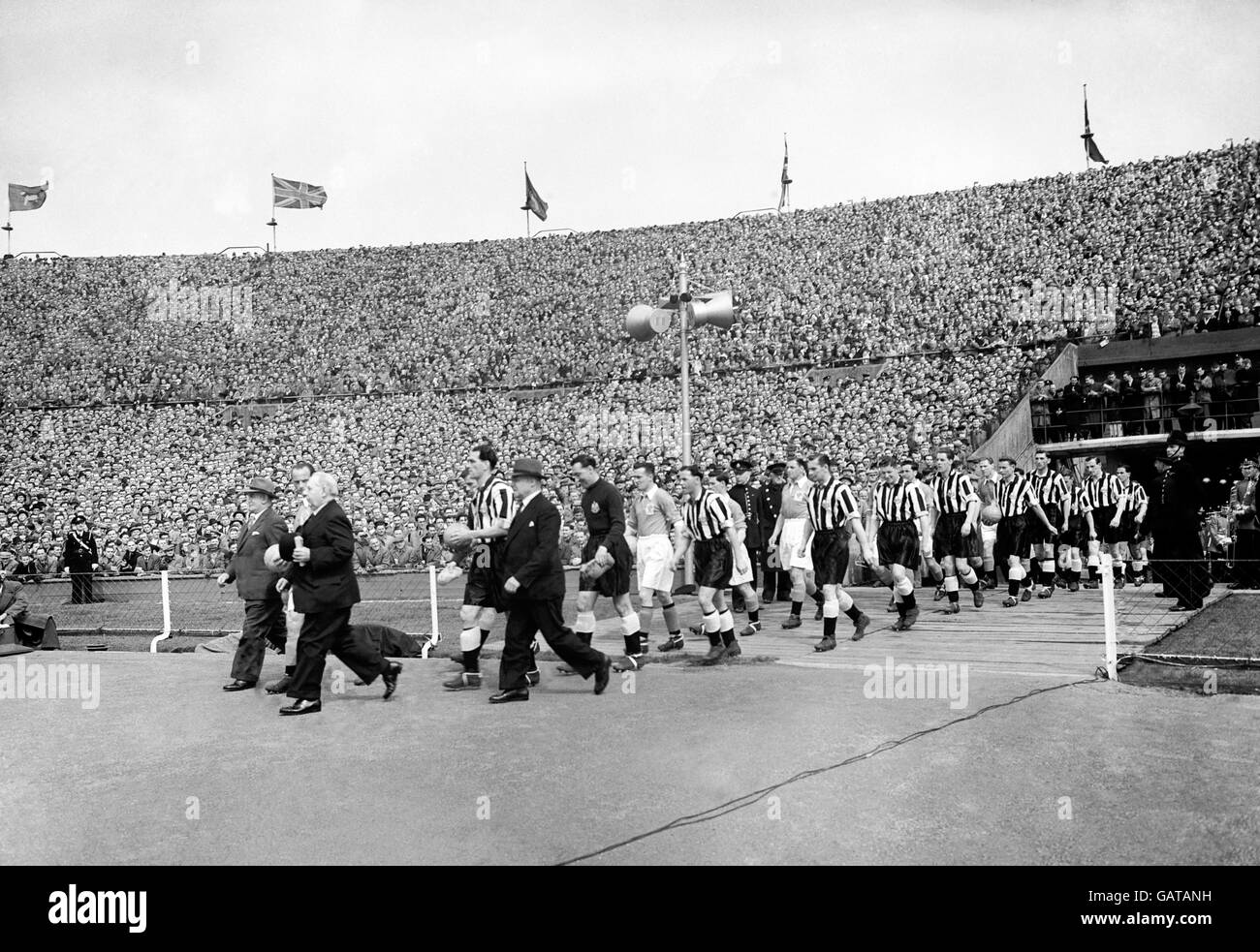 Newcastle United and Blackpool football teams taking to the field. Stock Photo