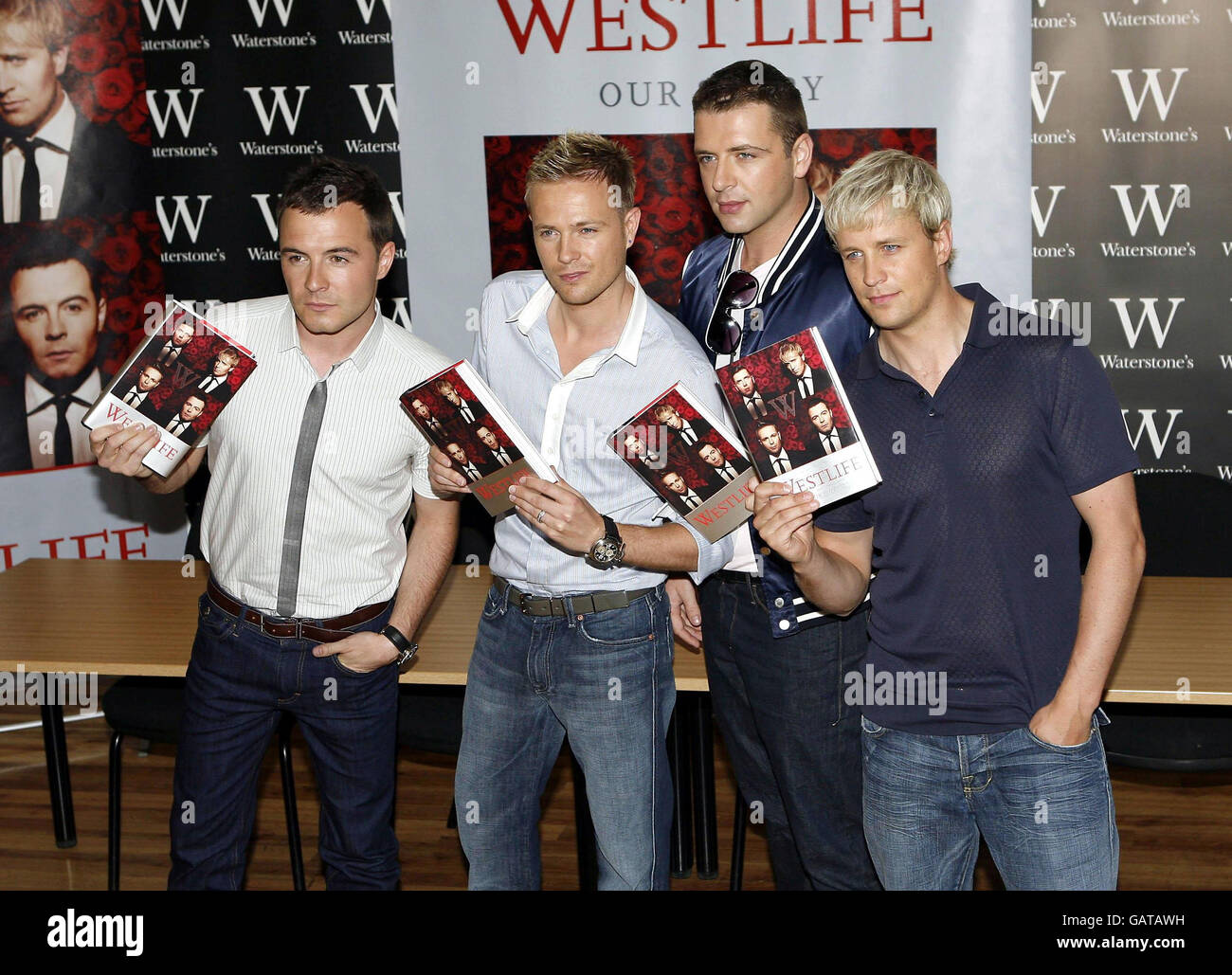 Westlife (l-r) Shane Filan, Nicky Byrne, Mark Feehily and Kian Egan, sign copies of their autobiography, 'Westlife: Our Story' at Waterstones in Piccadilly, central London. Stock Photo