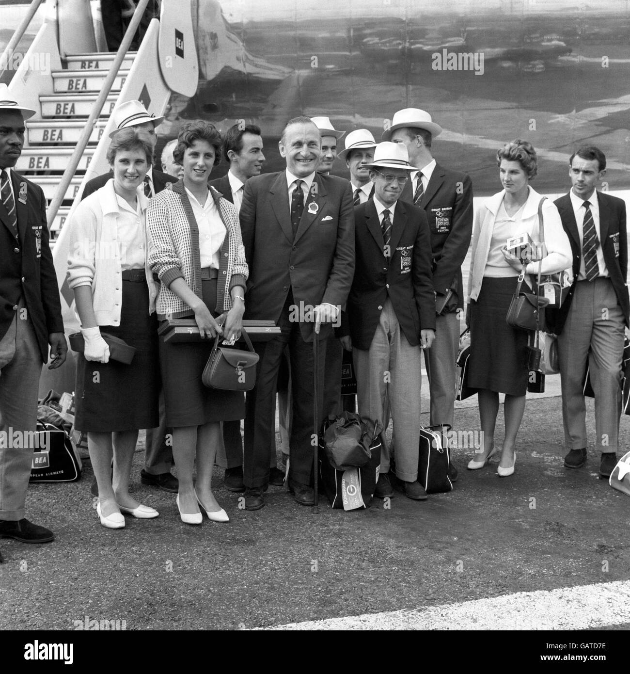 (L-R) Some of the British medallists pictured upon their arrival at London Airport: High jumper Dorothy Shirley (silver), 100m runner Dorothy Hyman (silver), Lord Burghley, The 6th Marquis of Exeter, 50km walker Don Thompson (gold), and 80m hurdler Carol Quinton (silver) Stock Photo