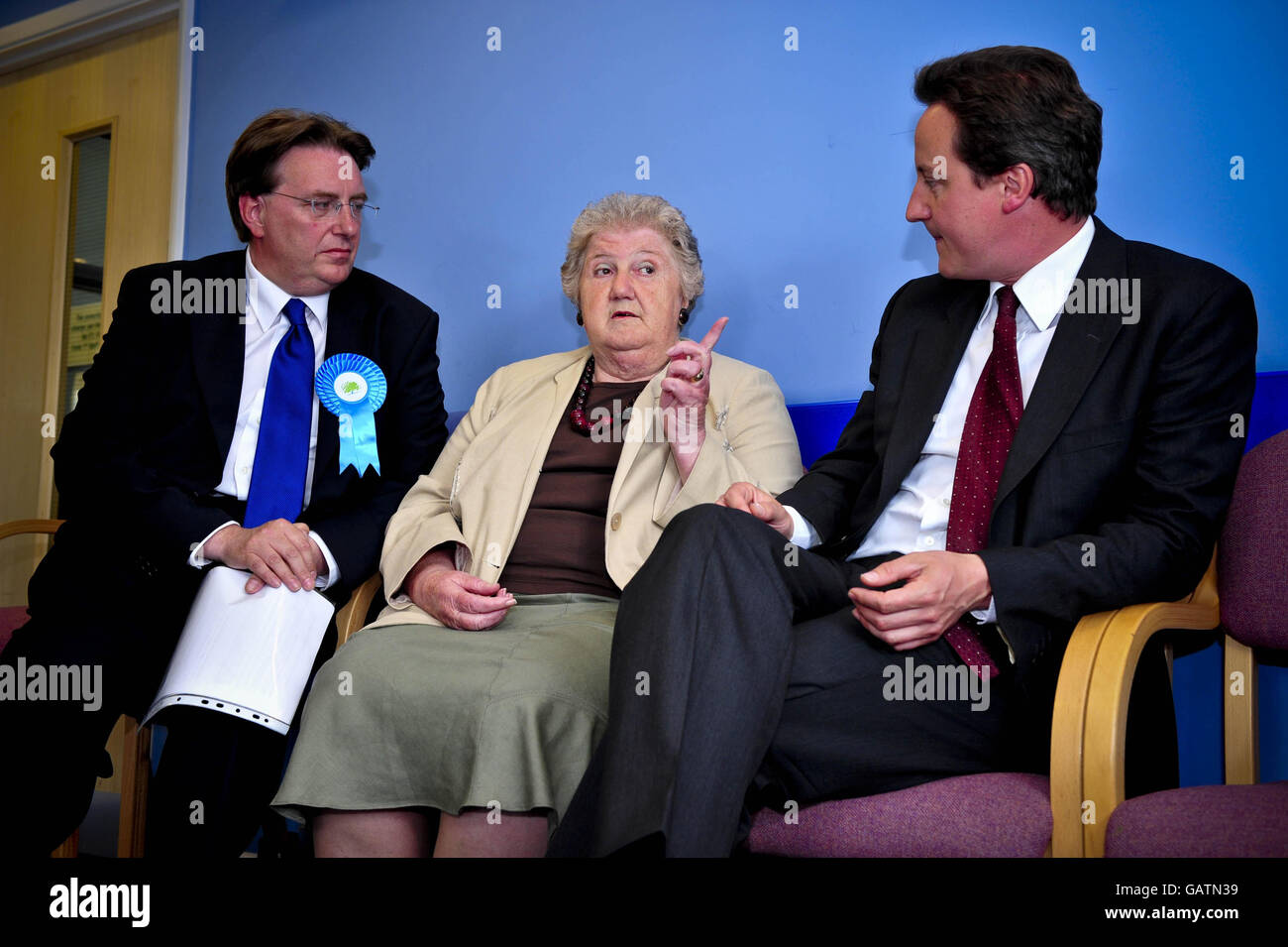 (left to right) John Howell, the Conservative party candidate for the Henley-on-Thames by-election, meets patient Edna Smith, 69, with Conservative leader David Cameron during a visit to the Nettlebed surgery in the constituency. Stock Photo
