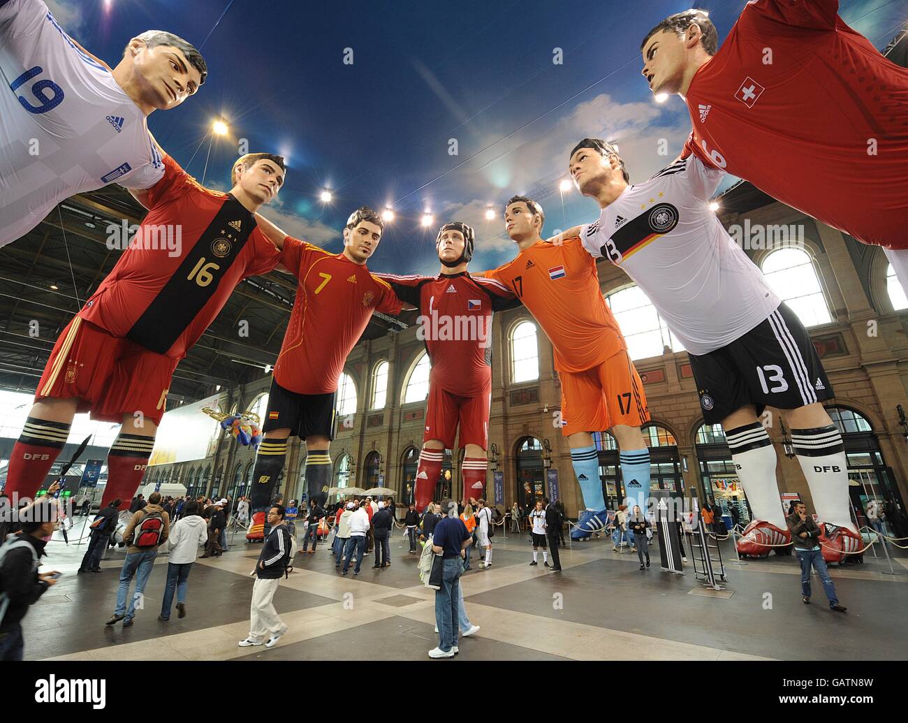 Giant models of Euro 2008's top players on display at the train station in Switzerland Stock Photo