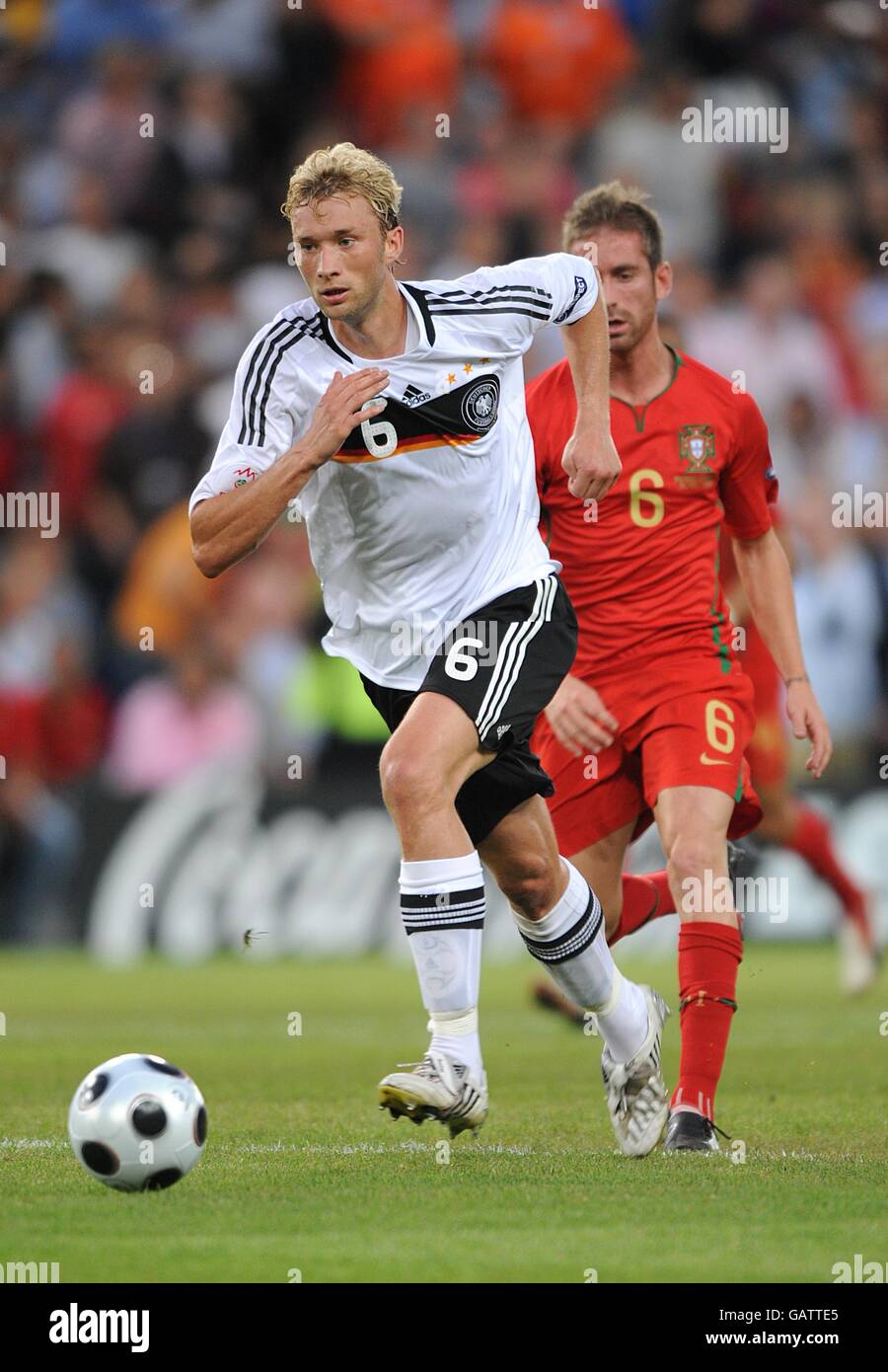 Soccer - UEFA European Championship 2008 - Quarter Final - Portugal v Germany - St Jakob-Park. Germany's Simon Rolfes attempts to get away from Portugal's Jose Raul Meireles Stock Photo